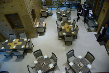 Restaurant from above — grey and gold tones