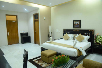 Super Deluxe room at Buddha Heritage — king bed, pillowtop, modern amenities